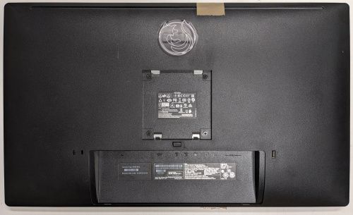 Dos du moniteur, pied démonté, avec l’étiquette signalétique près des prises